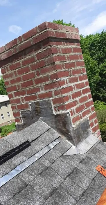 Brick chimney with flashing