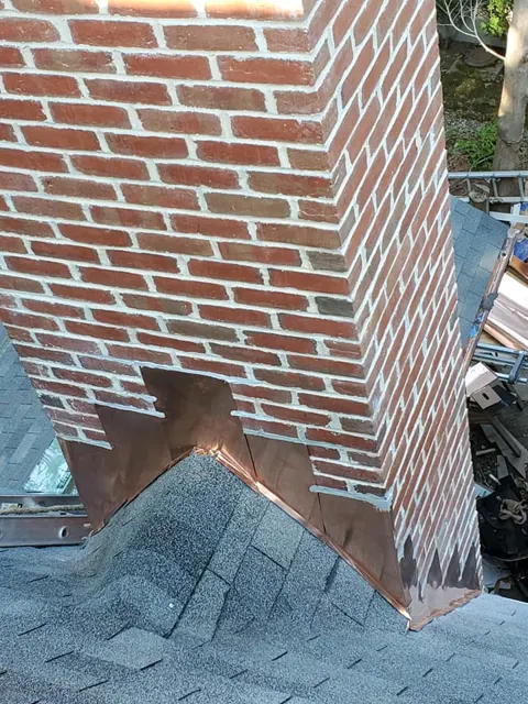 Brick chimney flashing on a new roof